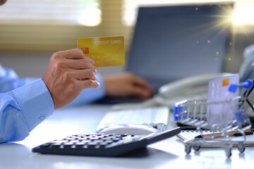 Poster - Online Payments, Businessman Hand Using Credit Card Payments, Online Payments Human hands handle credit cards and utilize a laptop to shop online.