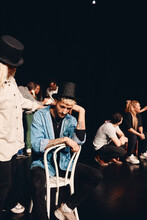 Sad Man Wearing Hat Practicing Act With Woman On Stage