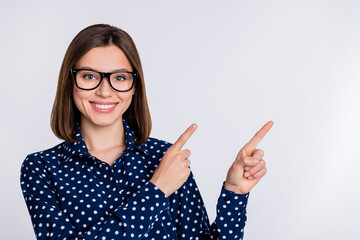 Sticker - Portrait of attractive cheerful content girl demonstrating copy blank space ad look idea isolated over gray pastel color background