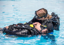 Scuba Diving Rescue Course Surface Skills Checking For Breathing Of An Unconscious Diver