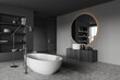 © ImageFlow - Corner view on dark bathroom interior with large round mirror