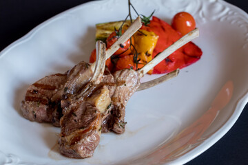 Wall Mural - Rack of lamb with grilled vegetables on white plate