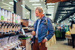 © bernardbodo - Mature man shopping in market