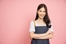 Young Asian Woman With Jeans Apron Isolated On Pink Background