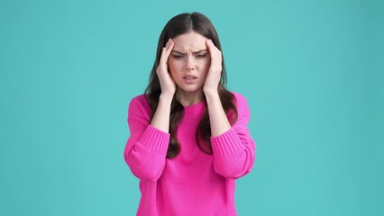 Wall Mural - Lady rubbing forehead suffer head ache isolated cyan color background