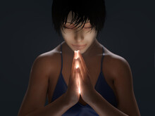 Young Woman Praying In The Dark