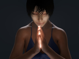 young woman praying in the dark