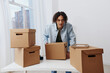 © SHOTPRIME STUDIO - handsome guy unpacking things from boxes in the room interior