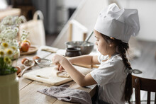 Cute Little Girl Baking Homemade Sweet Pie Together, Having Fun. Home Bakery, Little Kids In Process Of Food Preparation In The Kitchen At Home, Helping Mother, Doing Chores