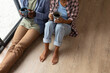 © Wavebreak Media - High angle low section of african american young couple with coffee mugs sitting on floor at home