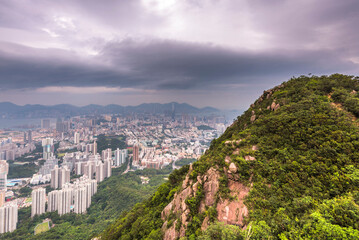 Wall Mural - Kowloon city view from Lion Rock hill against cloudy sky during daytime in Hong Kong, China