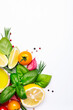 Fresh summer spicy herbs and spices for mediterranean diet. Banner. Tomato, green basil, olive oil, garlic and other. Vegan healthy food on white background. Cooking concept, top view, copy space