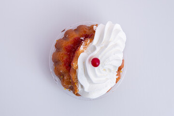 Wall Mural - Close-up top view shot of a savarina cupcake isolated on a white background