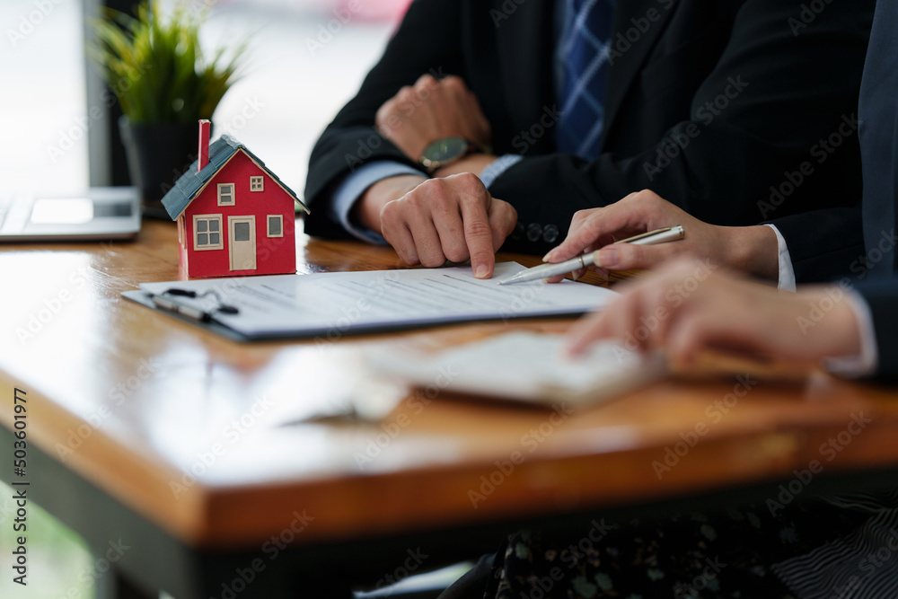 Close up Business woman or Real Estate agent explain signing agreement ...