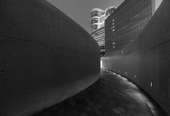 Poster - Empty modern pedestrian walkway in downtown at night