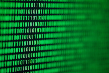 a stream of binary matrix code on the screen. numbers of the computer matrix. the concept of coding,