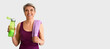 © Pixel-Shot - Sporty mature woman with bottle of water and towel on white background with space for text