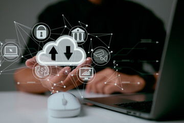 Leinwandbilder - A man uses a laptop with a cloud computing diagram shown on hand. Cloud computing networking and internet service principles for data storage.