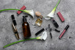 Composition with different cosmetic products, eyelash curler and calla lilies on grunge background