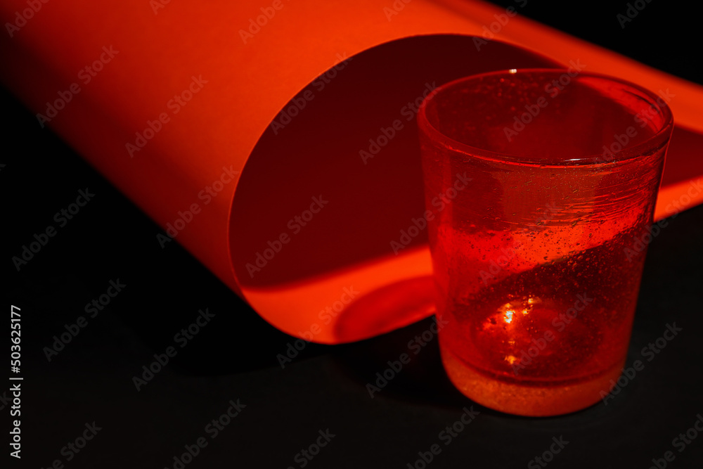 Stylish empty glass on dark background, closeup
