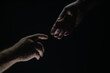 © Volodymyr - Men holding hands isolated on black. Connection and human relations. Male hands rescue. Friendly handshake, friends greeting, friendship. Rescue, helping gesture or hands. Helping hand. Hand creation