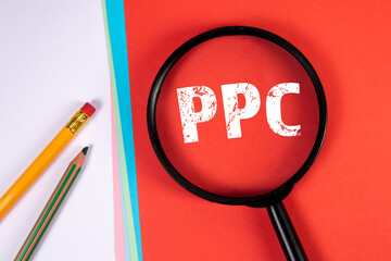 Canvas Print - PPC pay per click advertising in the internet. Magnifying glass and office supplies