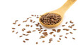 Wooden spoon with dark flax seeds on a white background