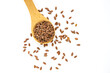 Wooden spoon with dark flax seeds on a white background,top view.