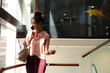 © Wavebreak Media - African american mid adult businesswoman talking on smart phone while standing in office