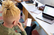 © Wavebreak Media - African american albino mid adult businessman using smart phone with blank screen in office