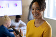 © Wavebreak Media - Portrait of smiling african american mid adult businesswoman with digital tablet standing in office