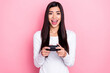 Photo of impressed young brunette lady playstation wear white shirt isolated on pink color background