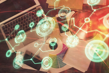 Poster - Social network hologram drawings over computer on the desktop background. Top view. Double exposure.