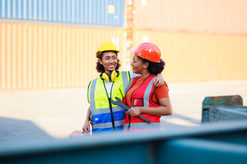 Two African american female mechanic working in car service and maintenance workshop. Mechanical fix car truck warehouse container yard