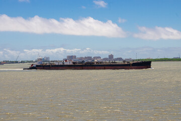 Wall Mural - Tanker push barge navigating in Houston ship channel.