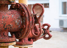 Shut-off Valve On High-pressure Gas Equipment. Old Rusty With Peeling Paint Taps On Gas Pipes