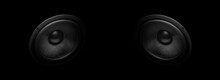 A Pair Of Modern Powerful Sound Speakers On A Dark Background.