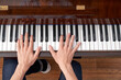 © ADDICTIVE STOCK - Unrecognizable male musician playing piano