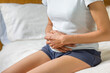 Woman holding stomach with cramp or pain