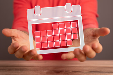 Poster - Minimal calendar icon with hand isolate on soft pink background. Paper calendar icons. Calendar date  3d