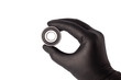 Male hand in nitrile glove holding metal roller bearing. Ball bearing isolated. Super Precision Ball Bearings used in high performance machinery.