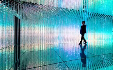 Businesswoman walking in the beautiful bokeh light