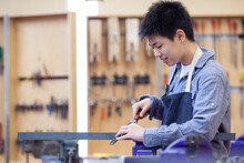 Asian, Middle School Student In Machine Shop Class