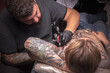 © Mr. Prof - Tattooer demonstrates the process of getting tattoo in tattoo studio