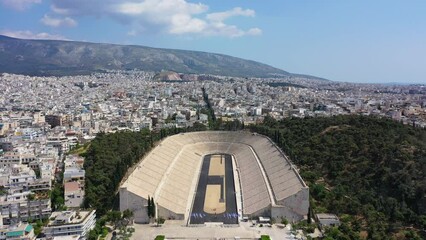 Wall Mural - Aerial drone video of iconic ancient Panathenaic stadium or Kalimarmaro birthplace of the original Olympic games, Athens historic centre, Attica, Greece