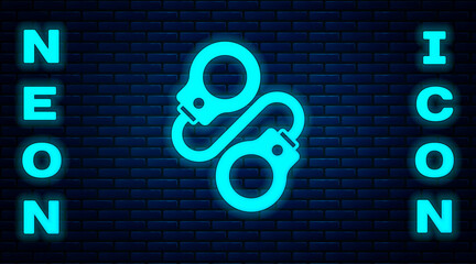 Poster - Glowing neon Handcuffs icon isolated on brick wall background. Vector