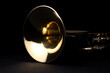 Closeup shot of a trumpet's parts on an isolated black background