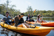 © Kawee - Asian attractive romantic young people rowing kayak in a forest lake.