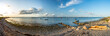 Panorama shot of peaceful pebble beach at the calm Baltic Sea in Westerholz in Northern Germany at sunset