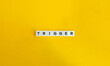 Trigger Word on Letter Tiles on Yellow Background. Minimal Aesthetics.